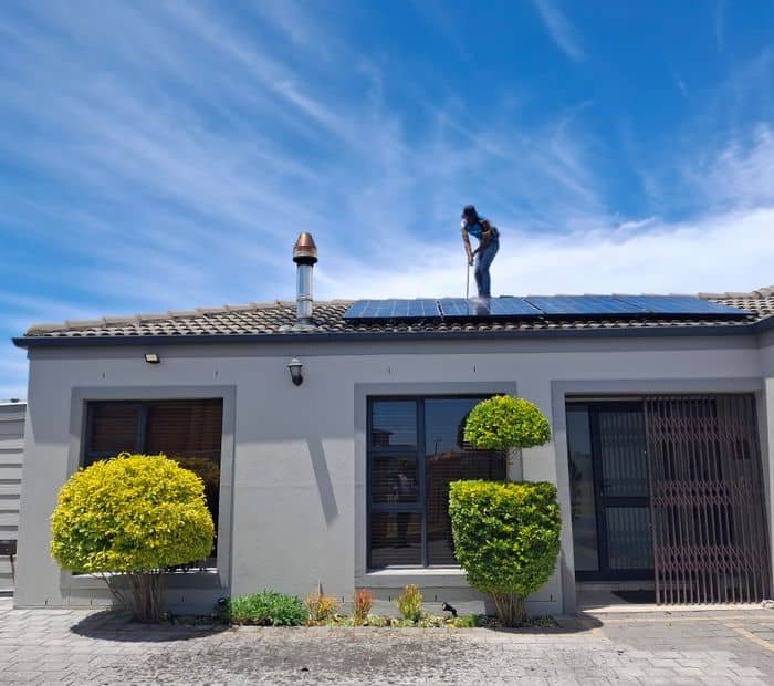 Installing solar panels on a house roof